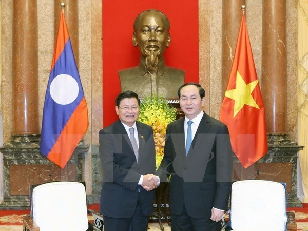 President Tran Dai Quang greets Lao PM - ảnh 1